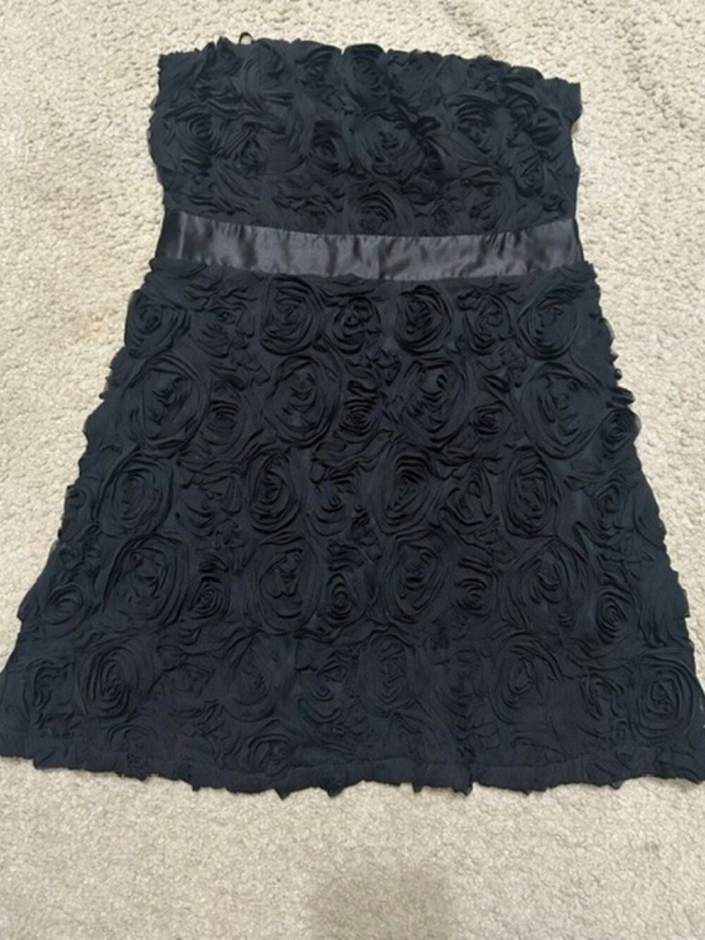 Black strapless mini dress with all-over 3D rose-textured rosette pattern. (L)